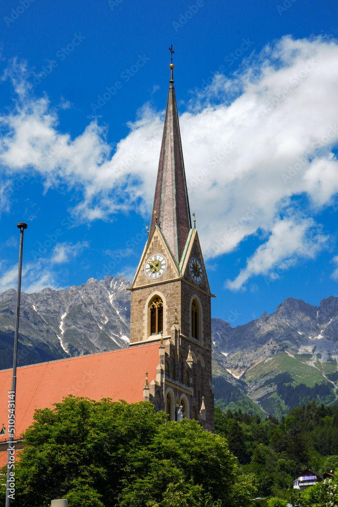 Gothic cathedral tower in Innsbruck Old town in Alps mountains, Tyrol, Austria