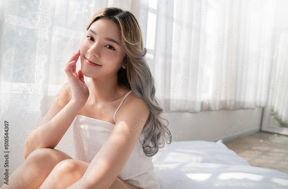 Closeup portrait of beauty asian woman with fair perfect healthy glow skin hand touching cheek chin copy space, young beautiful asia girl with pretty smile face Beauty korean women spa skincare banner Closeup portrait of beauty asian woman with fair perfect healthy glow skin hand touching cheek chin copy space, young beautiful asia girl with pretty smile face Beauty korean women spa skincare banner