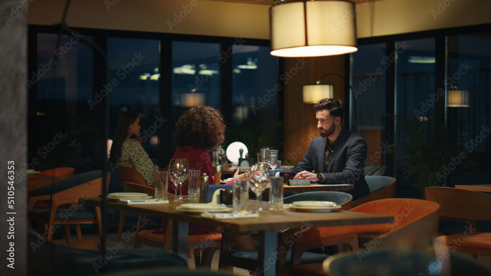Multiethnic couple enjoy dinner date in fancy restaurant table. Romance concept. Multiethnic couple enjoy dinner date in fancy restaurant table. Romance concept.