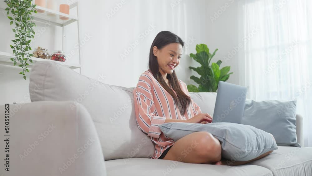 Asian young business woman typing on computer and working from home. Asian young business woman typing on computer and working from home.