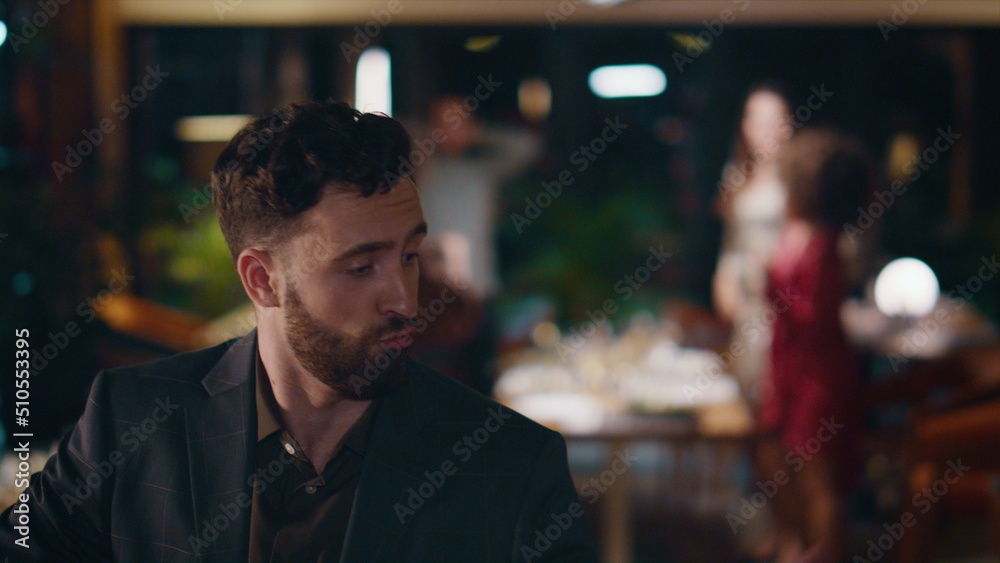 Fototapeta premium Happy guy dancing party in restaurant. Handsome man enjoying celebration in bar.