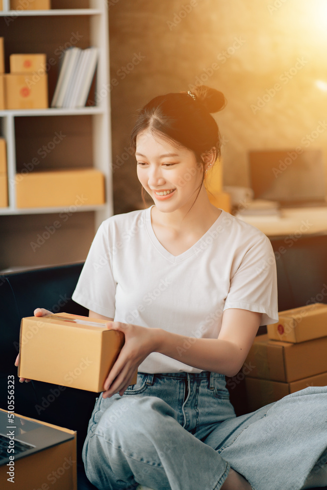 Asian woman working in modern warehouse and delivery service via modern technology Asian woman working in modern warehouse and delivery service via modern technology