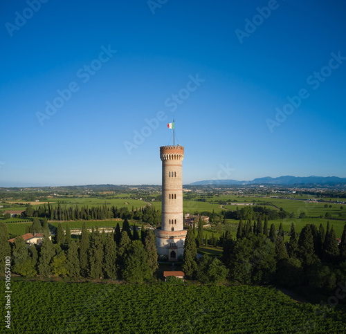 Aerial view of the tower on Lake Garda. Aerial panorama of Tower of San Martino della Battaglia, italy. Tower surrounded by vineyards drone view.