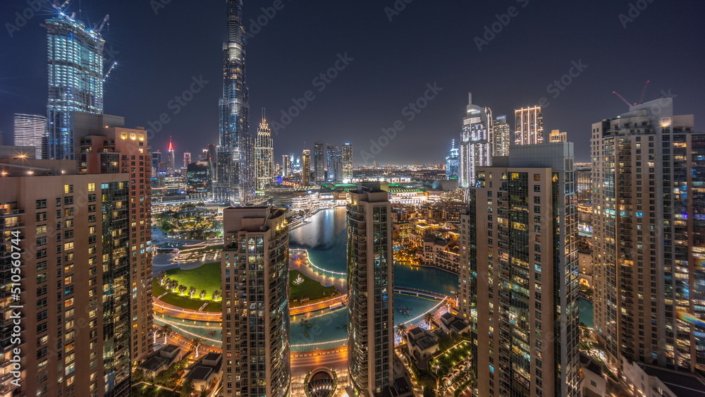 Fototapeta premium Dubai Downtown cityscape with tallest skyscrapers around aerial night timelapse.