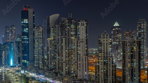 Bay Avenue with modern towers residential development in Business Bay aerial night timelapse  Dubai