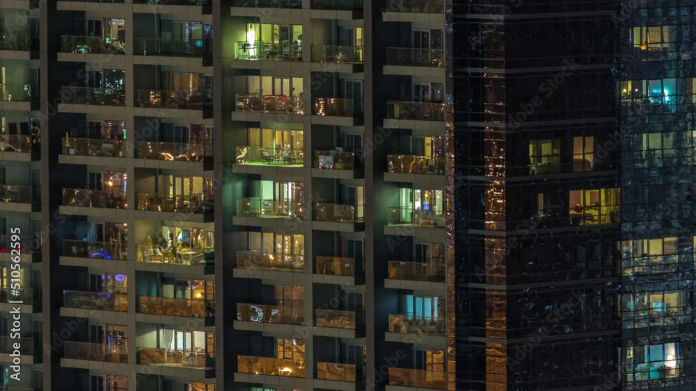 Windows of apartment building at night timelapse, the light from illuminated rooms of houses. Urban landscape of the skyscrapers Windows of apartment building at night timelapse, the light from illuminated rooms of houses. Urban landscape of the skyscrapers