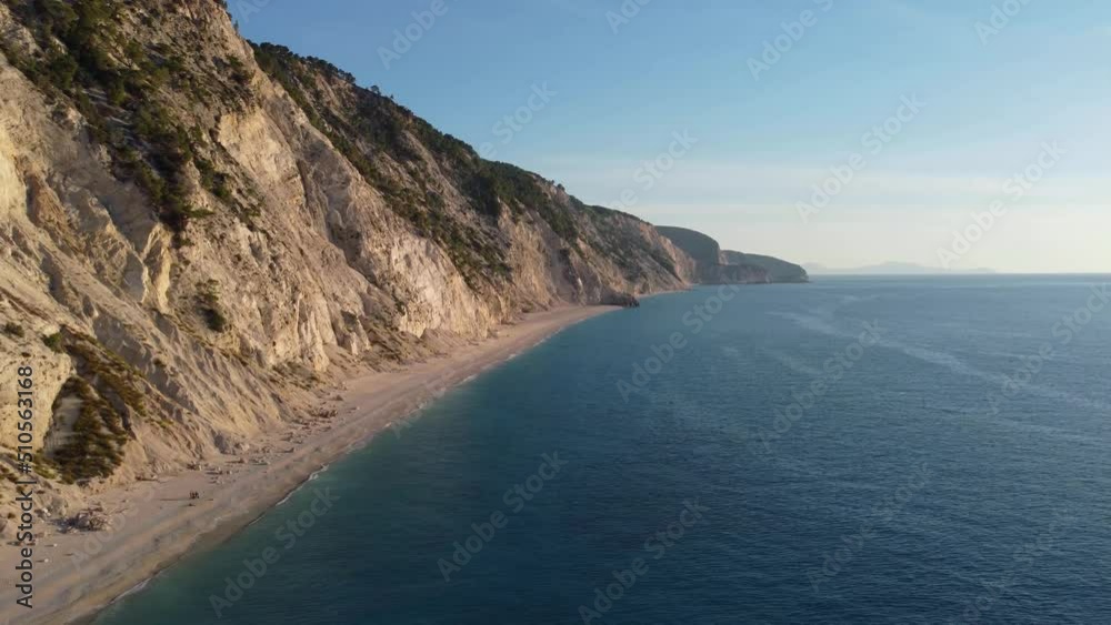 Drone shot of beautiful scenic beach with white sand and blue sea water, sunset, sunrise. Greece, Egremni beach of Lefkada island. Drone shot of beautiful scenic beach with white sand and blue sea water, sunset, sunrise. Greece, Egremni beach of Lefkada island.