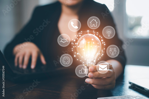 thinking and creative concept, Close up the light bulb and woman working on the desk, Creativity, and innovation are keys to success, new idea and innovation with Brain and light bulbs,big data