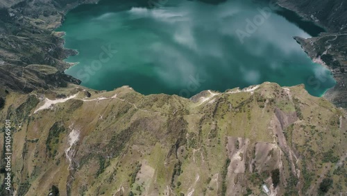 Fly Over Quilotoa Crater Lake In Ecuadorian Andes Volcano In South America. Aerial Tilt-up