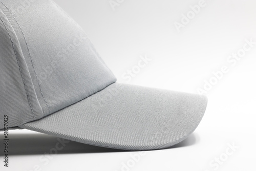 visor of light grey plain cap for men isolated on a white background, side view