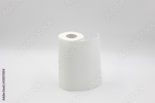 roll of white paper napkins for kitchen and cleaning on a white background