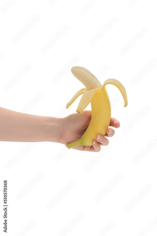 Young woman's hand holding a beautiful, fresh, yellow banana. Isolated on white background. Healthy sweet summer food. Side view.