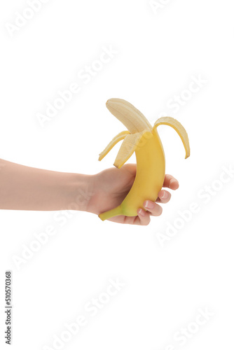 Obraz na płótnie Young woman's hand holding a beautiful, fresh, yellow banana. Isolated on white background. Healthy sweet summer food. Side view. w salonie