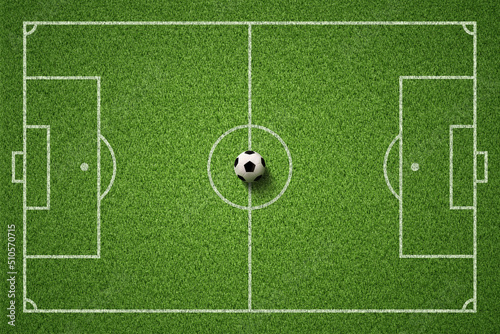 Soccer field or Football field with soccer ball on green grass background