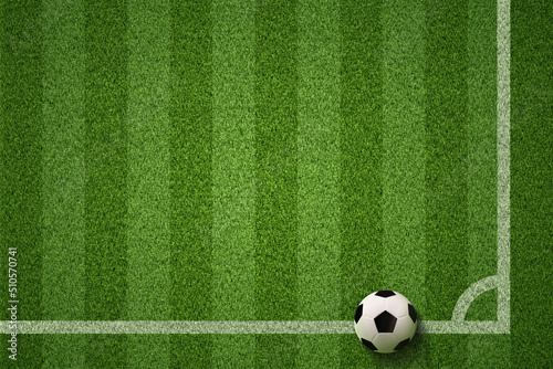Soccer field or Football field with soccer ball on green grass background