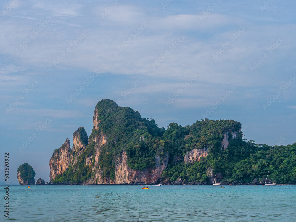 Vacation holidays summer background. A beautiful view of island with boats and tourists in the island. Thailand Vacation holidays summer background. A beautiful view of island with boats and tourists in the island. Thailand