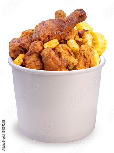 Delicious Korean fried chicken in paper bucket isolated on white background, Fried chicken and korean rice cake on white With clipping path.