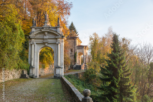 Sacred way at sunset. Sacro Monte di Varese or Santa Maria del Monte, Italy, UNESCO site with the third arch and the eleventh chapel