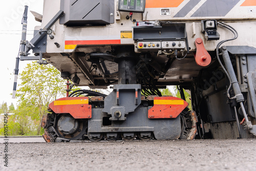  Large Road cold milling machine removes the old asphalt and loading  © Андрей Знаменский