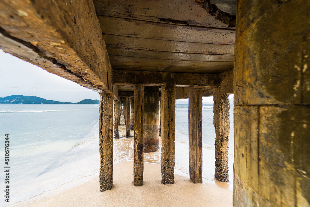 View Under the bridge walkway at the pier from the beach to the sea.Thailand.