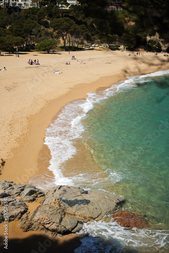 Costa Brava beach with turquoise water on sunny day