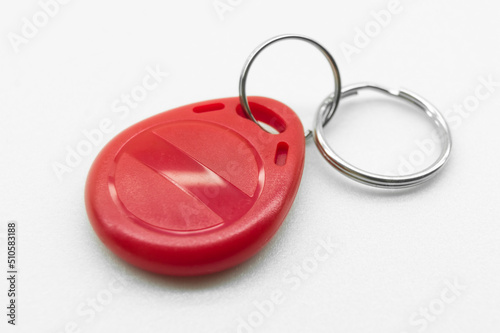 RFID tag key chain. Plastic cloned non-contact electronic radio key for intercom. NFC tag. Selective focus
