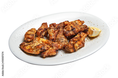 White plate with roasted chicken wings.