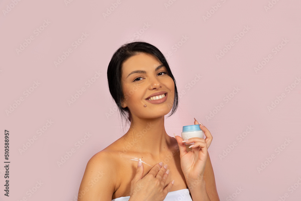 face cream mock up holding in hand, smiling brunette Caucasian woman face cream mock up holding in hand, smiling brunette Caucasian woman