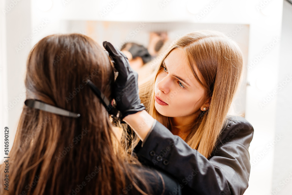Fototapeta premium Eyebrow brush. Eyebrow care in the salon