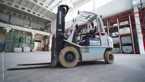 Forklift Stands in a Warehouse