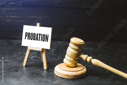 Probation and judge's gavel. Consideration of an application for early release from imprisonment. Protection of workers rights. Test period. Performance and efficiency testing. photo
