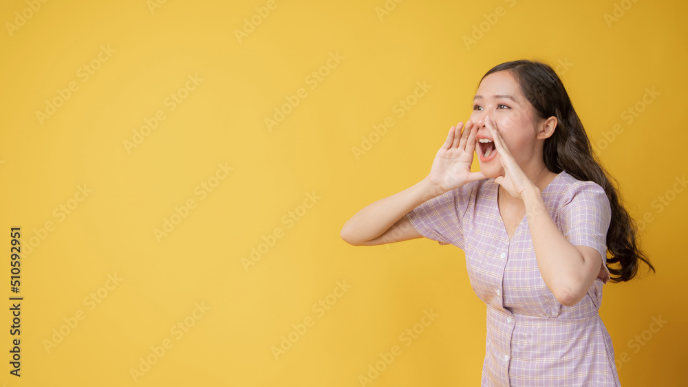Woman teen standing big shout out with hands next mouth giving excited positive, present and call on orange background Woman teen standing big shout out with hands next mouth giving excited positive, present and call on orange background