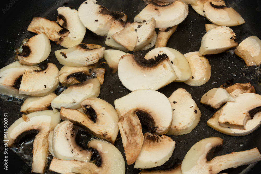 Washed and chopped cultivated mushrooms, close-up on agriculture and cooking Washed and chopped cultivated mushrooms, close-up on agriculture and cooking