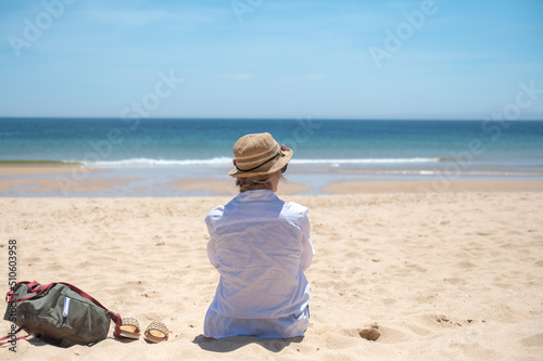 Blonde woman in the Algarve, Portugal in the summer of 2022.