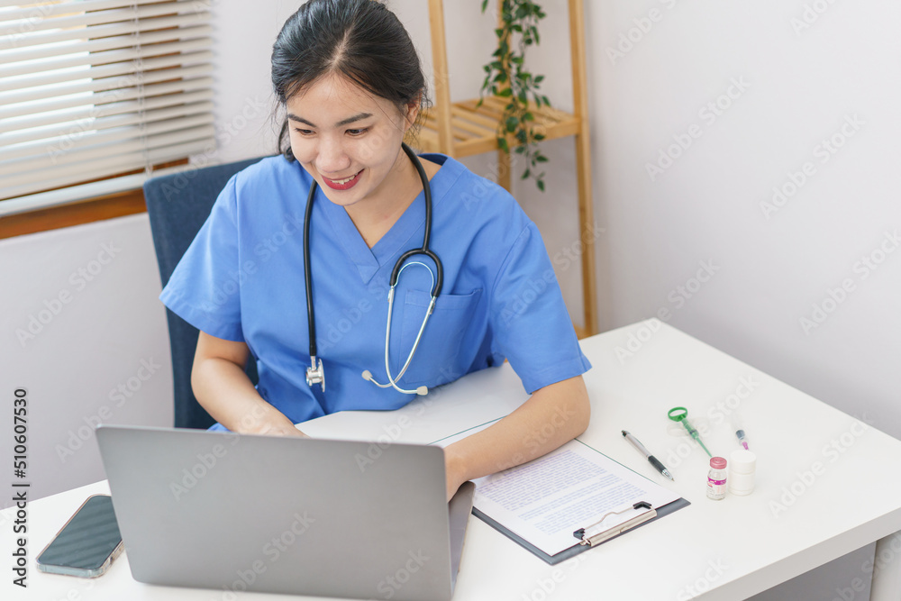 Pet care concept, Female veterinary using laptop for relaxation after examining health pet Pet care concept, Female veterinary using laptop for relaxation after examining health pet