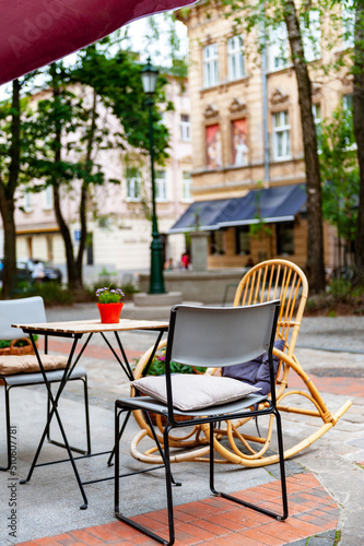 Chairs and table on empty terrace at cafe . © Pavlo Burdyak