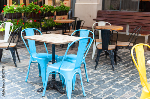 Chairs and table on empty terrace at cafe .