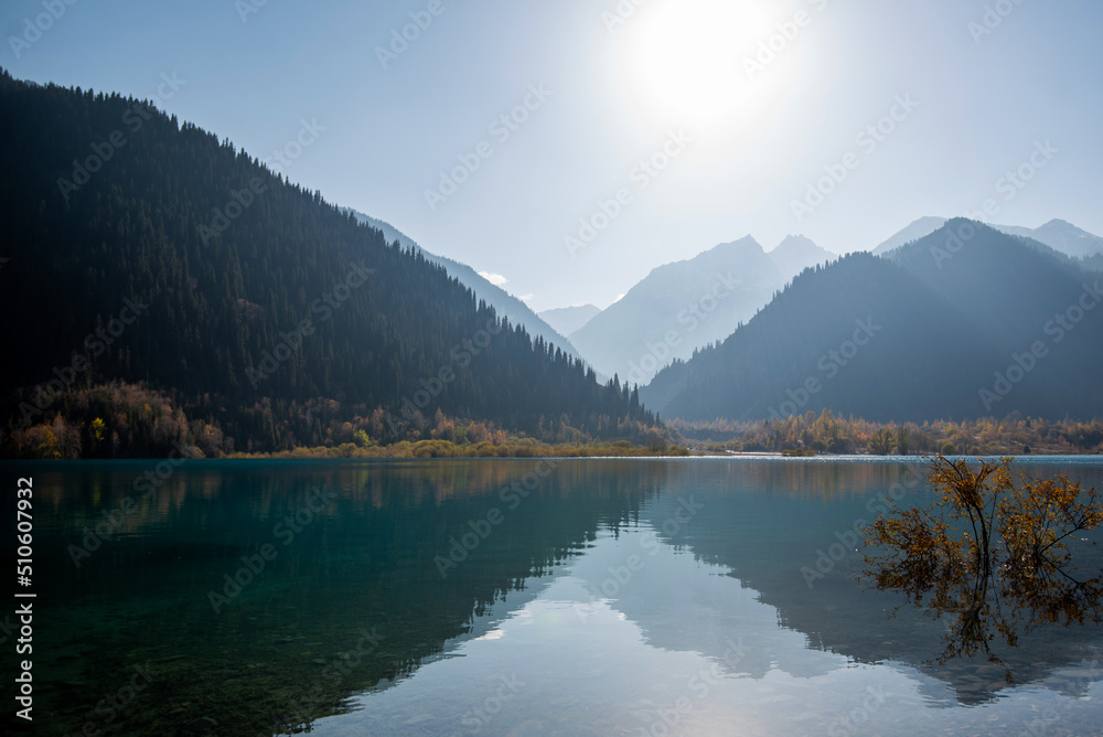 Serenity lake in the mountains. Foggy autumn morning with mountains and reflection. Serenity lake in the mountains. Foggy autumn morning with mountains and reflection.