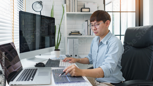 Software development concept, Male programmer pointing on data code to checking website programming