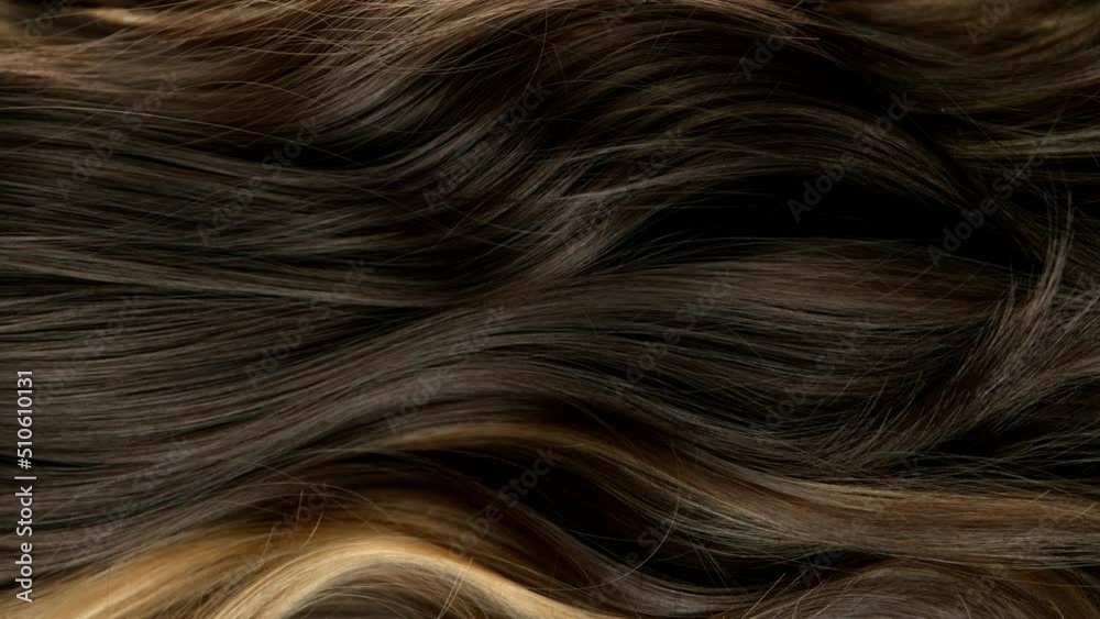 Super slow motion of wavy brown hair in detail. Filmed on high speed cinema camera, 1000 fps. Super slow motion of wavy brown hair in detail. Filmed on high speed cinema camera, 1000 fps.