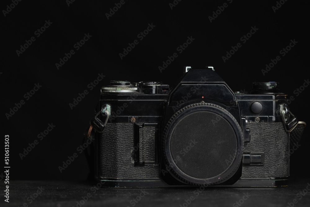 vintage film photo camera isolated on black