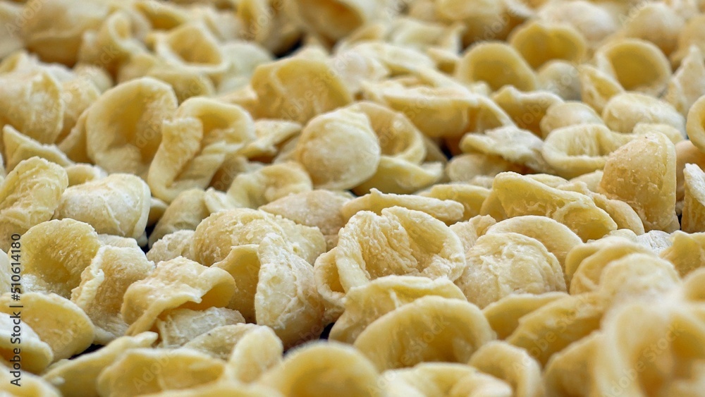 Close-up image of fresh handmade Apulian orecchiette pasta. Typical Italian pasta recipe Close-up image of fresh handmade Apulian orecchiette pasta. Typical Italian pasta recipe