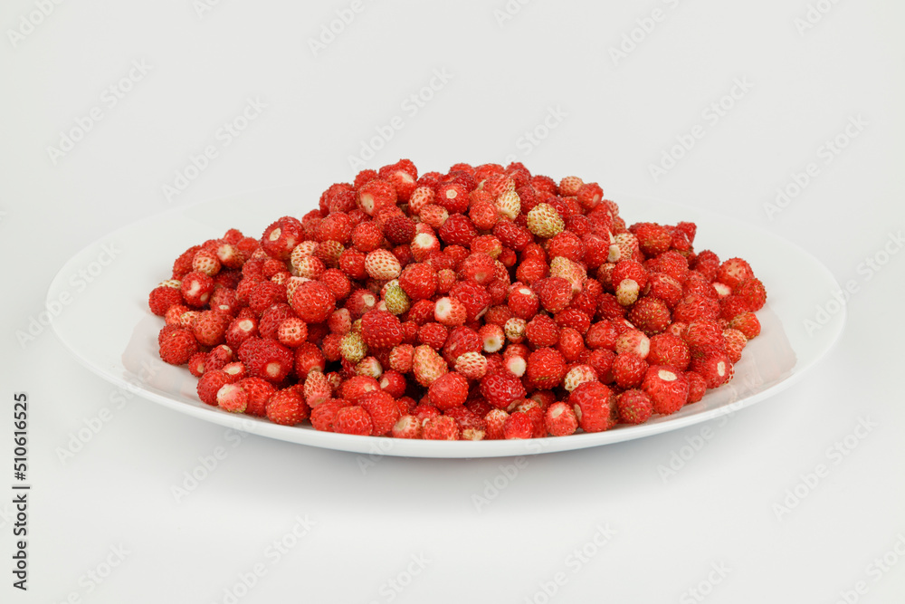 Plate full of wild strawberries, ripe red berries. Plate full of wild strawberries, ripe red berries.