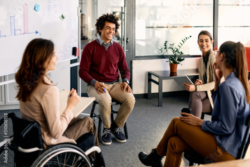 Multiracial group of business colleagues brainstorming during presentation in the office.