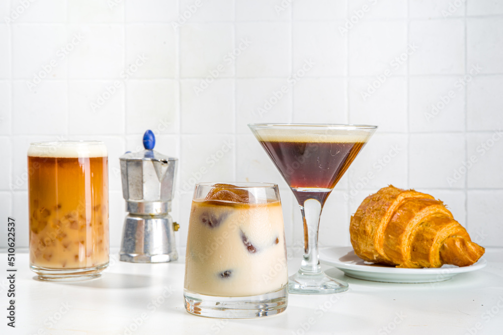 Set of three coffee drinks in various cocktails glasses, on white background copy space Set of three coffee drinks in various cocktails glasses, on white background copy space