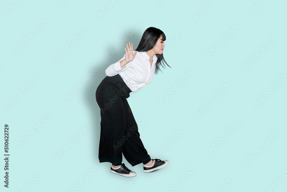 Businesswoman dance with silly movement on studio Businesswoman dance with silly movement on studio