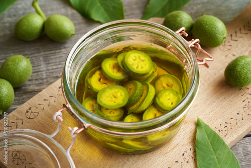 Preparation of homemade nut liqueur from unripe walnuts in june