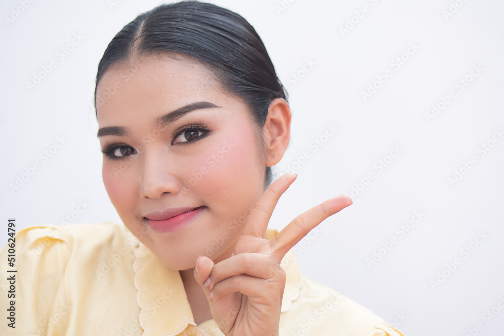 asian plus size woman pointing up confident two fingers sign, v for victory asian plus size woman pointing up confident two fingers sign, v for victory