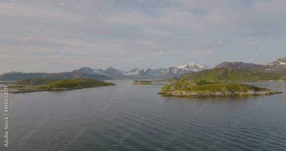 Panoramic of natural coastal landscape, Kvaløya Island. Bridge between islands and tall mountains - aerial Panoramic of natural coastal landscape, Kvaløya Island. Bridge between islands and tall mountains - aerial