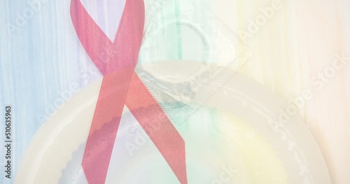 Double exposure of red ribbon and condom, copy space